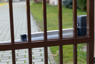 Shiny Brown coloured Automatic gate with Gate opener installed perfectly to enhance security