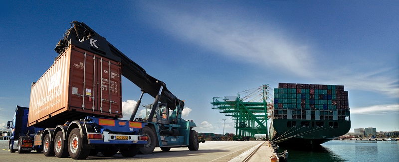 A heavy-weight truck loaded with large containers kept near sea port. 